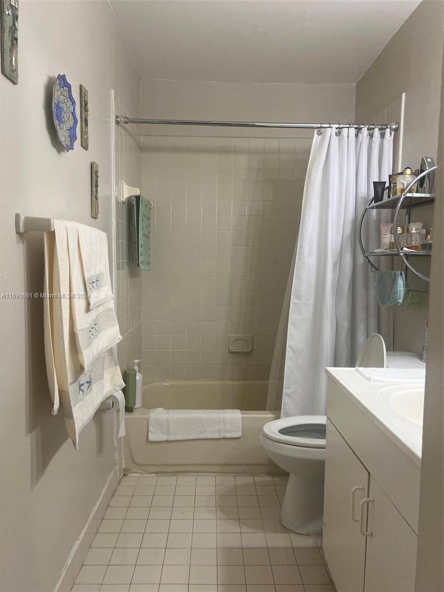 16331 Southwest 104th Avenue Miami, FL 33157 - Photo 14 of 23 a bathroom with a shower a toilet and a sink