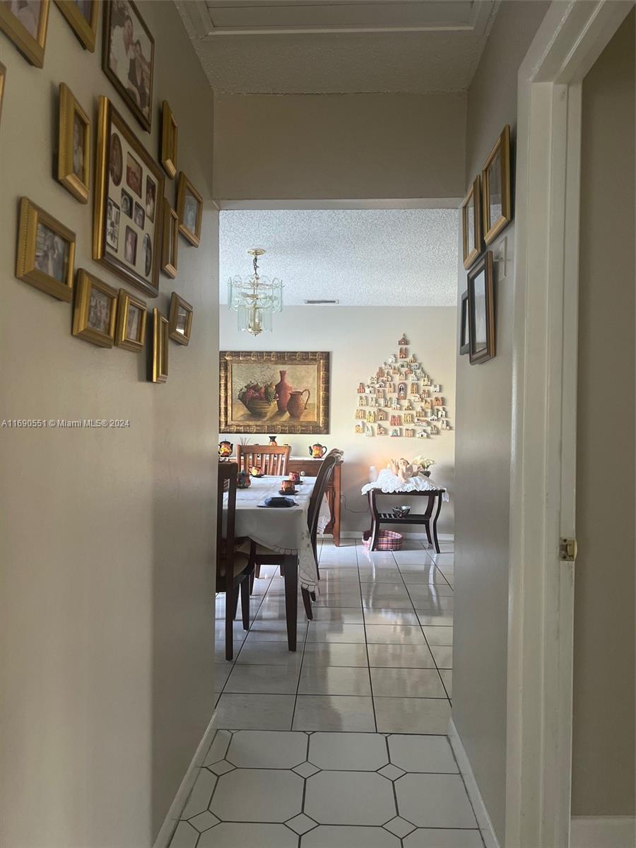 16331 Southwest 104th Avenue Miami, FL 33157 - Photo 15 of 23 a dining room with a table and chairs