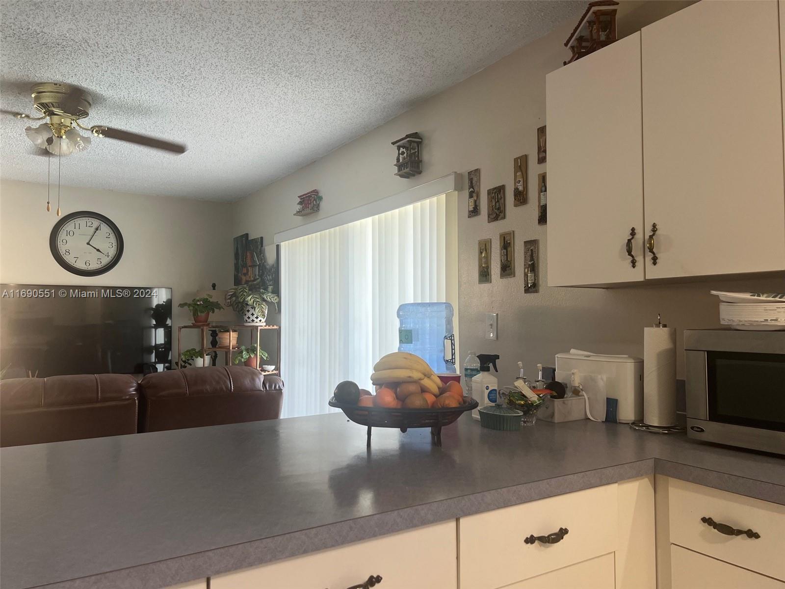16331 Southwest 104th Avenue Miami, FL 33157 - Photo 18 of 23 a kitchen with stainless steel appliances granite countertop a sink dishwasher and cabinets with wooden floor