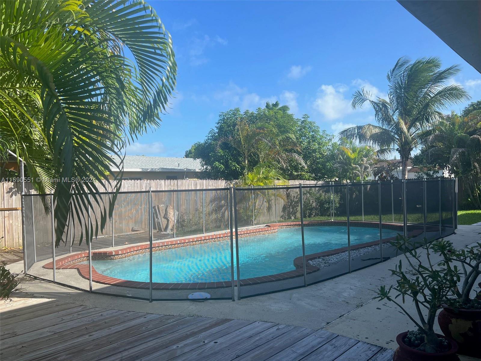 16331 Southwest 104th Avenue Miami, FL 33157 - Photo 19 of 23 a view of a backyard
