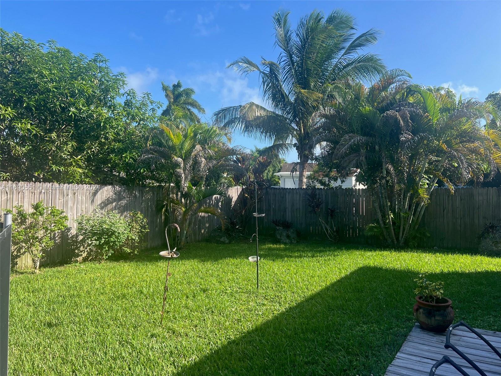 16331 Southwest 104th Avenue Miami, FL 33157 - Photo 20 of 23 a view of a backyard with a garden