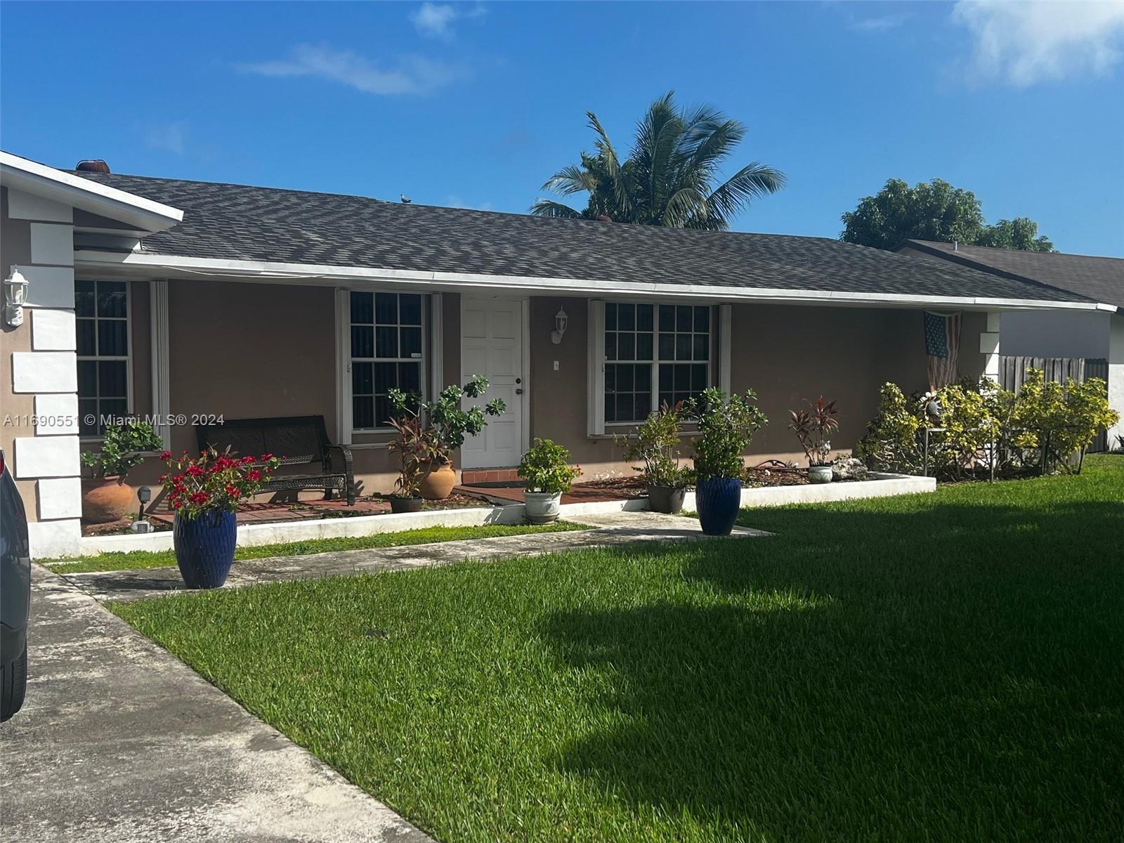 16331 Southwest 104th Avenue Miami, FL 33157 - Photo 3 of 23 a front view of house with yard and outdoor seating