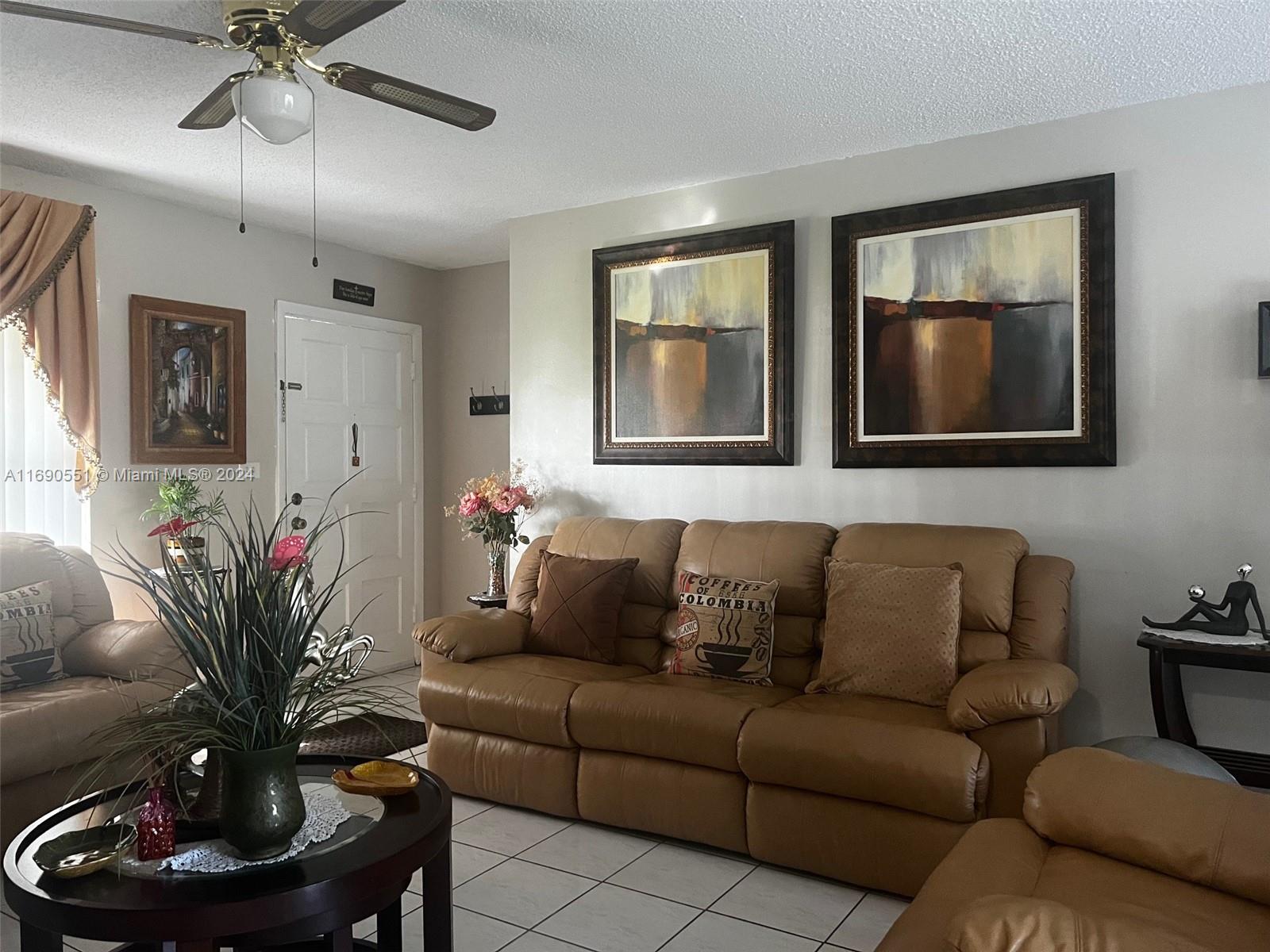 16331 Southwest 104th Avenue Miami, FL 33157 - Photo 6 of 23 a living room with furniture and a potted plant