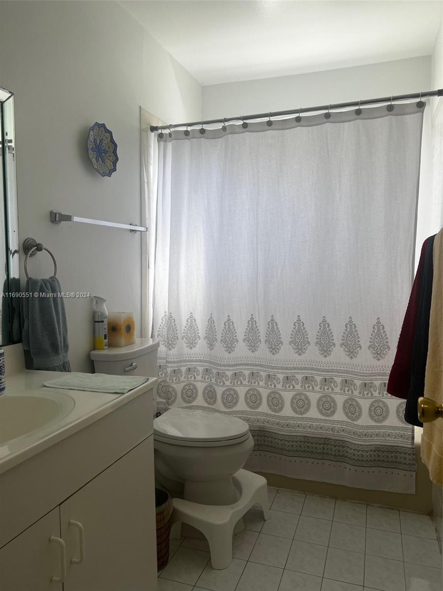 16331 Southwest 104th Avenue Miami, FL 33157 - Photo 9 of 23 a bathroom with a sink and a mirror