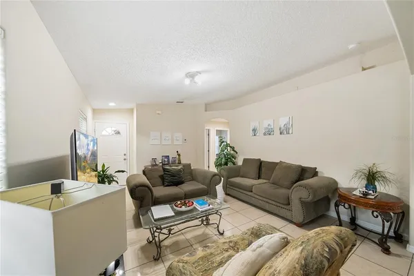 a living room with furniture and a table