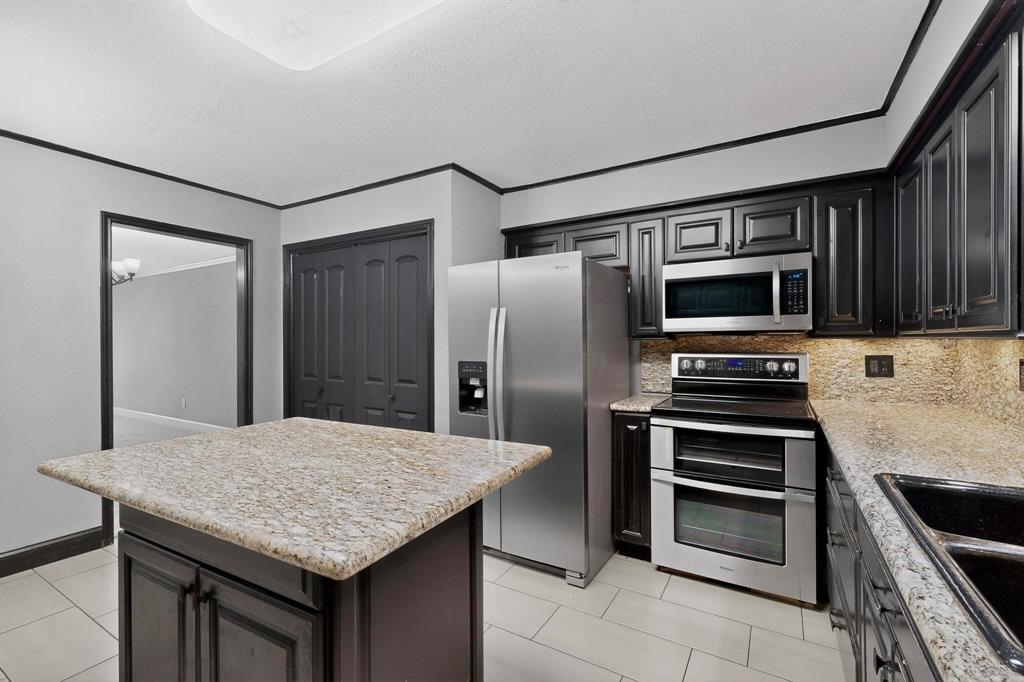 3675 Rickshaw Drive, Unit 3671 Dallas, TX 75229 - Photo 13 of 32 Stainless Steel Appliances with Electric Cooktop