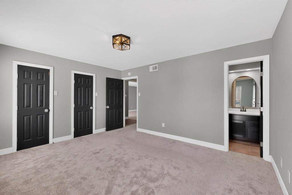 3675 Rickshaw Drive, Unit 3671 Dallas, TX 75229 - Photo 15 of 32 Master Bedroom with His and Her Closets