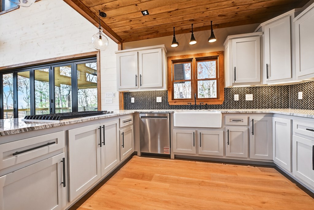 22 Mountain Trace Cherry Log, GA 30522 - Photo 15 of 49 a large kitchen with granite countertop a sink and cabinets