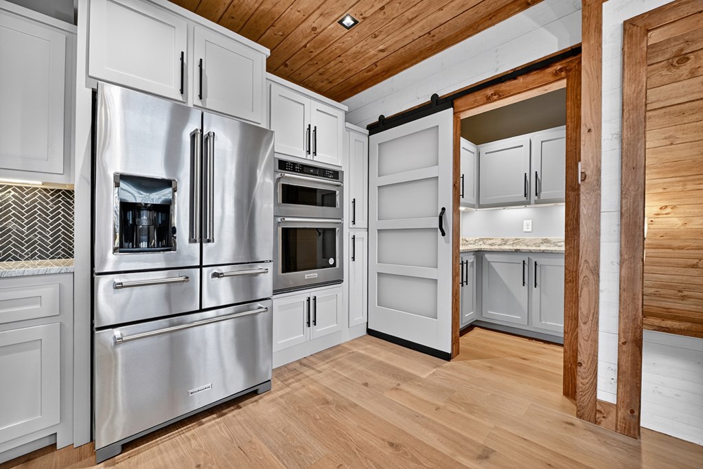 22 Mountain Trace Cherry Log, GA 30522 - Photo 16 of 49 a kitchen with stainless steel appliances a refrigerator and cabinets