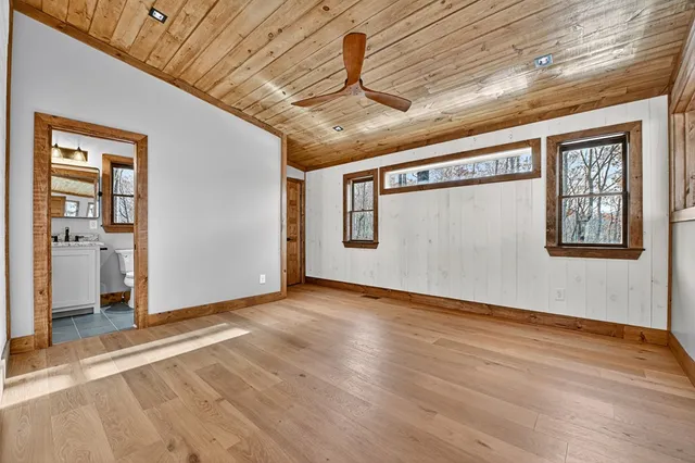 a view of an entryway with wooden floor