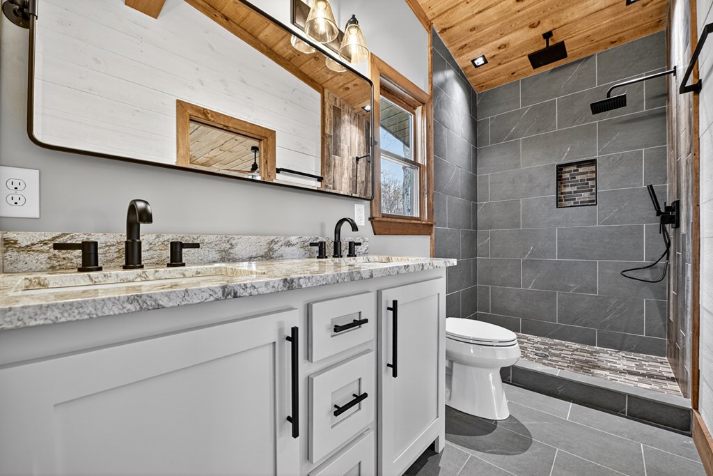 22 Mountain Trace Cherry Log, GA 30522 - Photo 33 of 49 a bathroom with a granite countertop sink toilet and shower