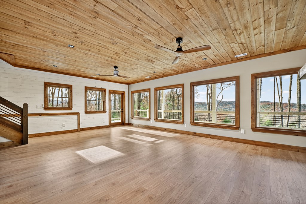 22 Mountain Trace Cherry Log, GA 30522 - Photo 36 of 49 a view of an empty room with wooden floor and a window