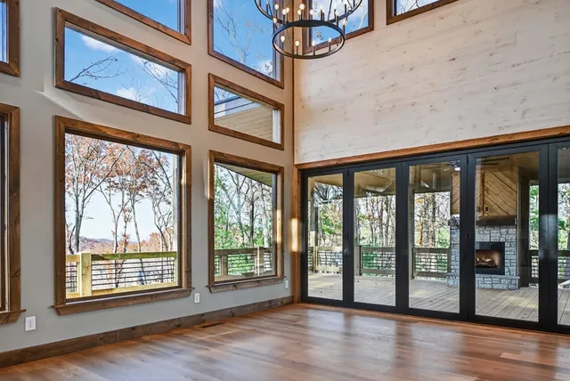 a view of an entryway with wooden floor and door