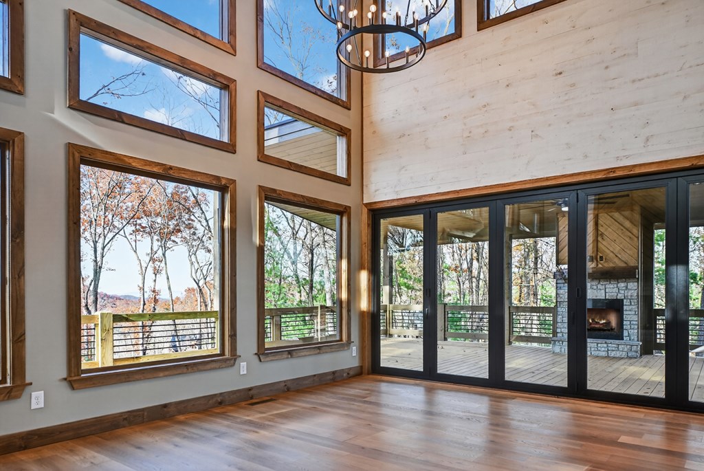 22 Mountain Trace Cherry Log, GA 30522 - Photo 6 of 49 a view of an empty room with wooden floor and a window