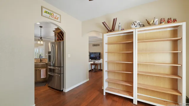 a kitchen with stainless steel appliances a refrigerator and cabinets