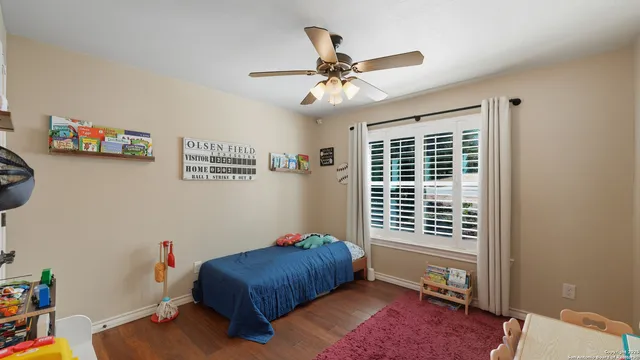 a bedroom with furniture and a window
