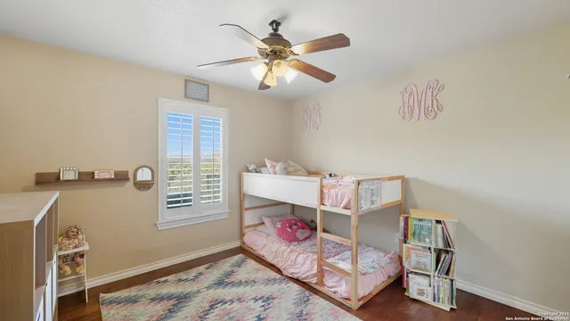 a bedroom with furniture and a window