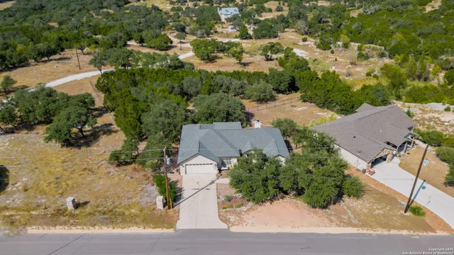 an aerial view of houses with yard