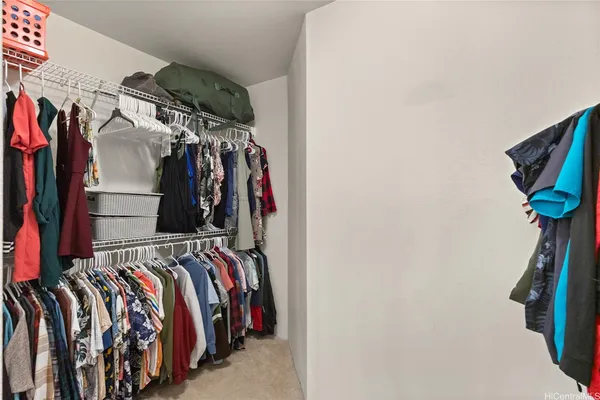 a bed room with a bed and a large mirror