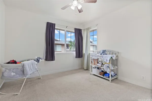 a view of livingroom with furniture and windows