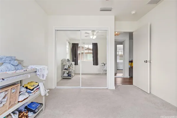 a bedroom with bed and window