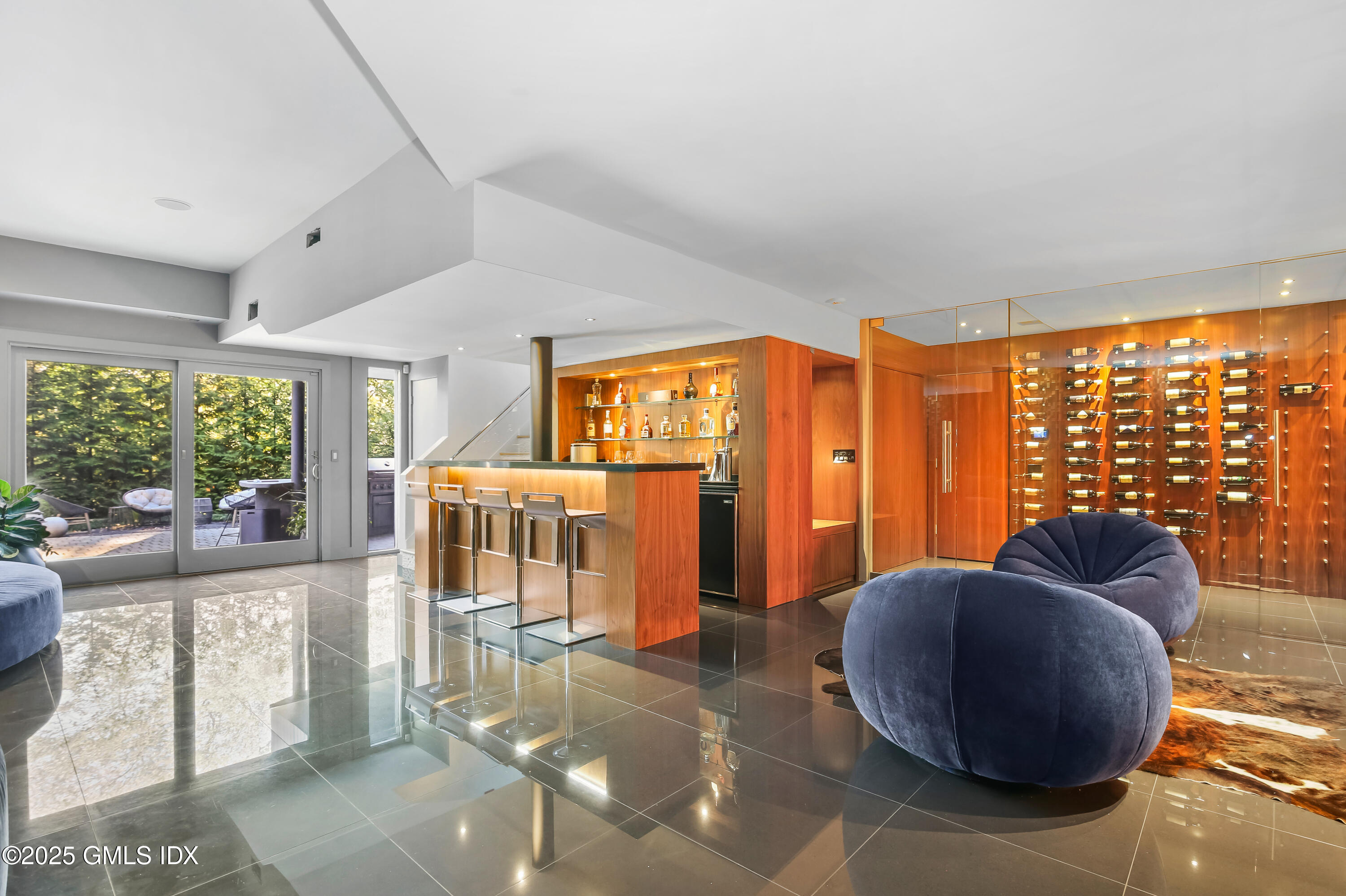 210 Red Fox Road Stamford, CT 06903 - Photo 20 of 25 a living room with furniture and large windows