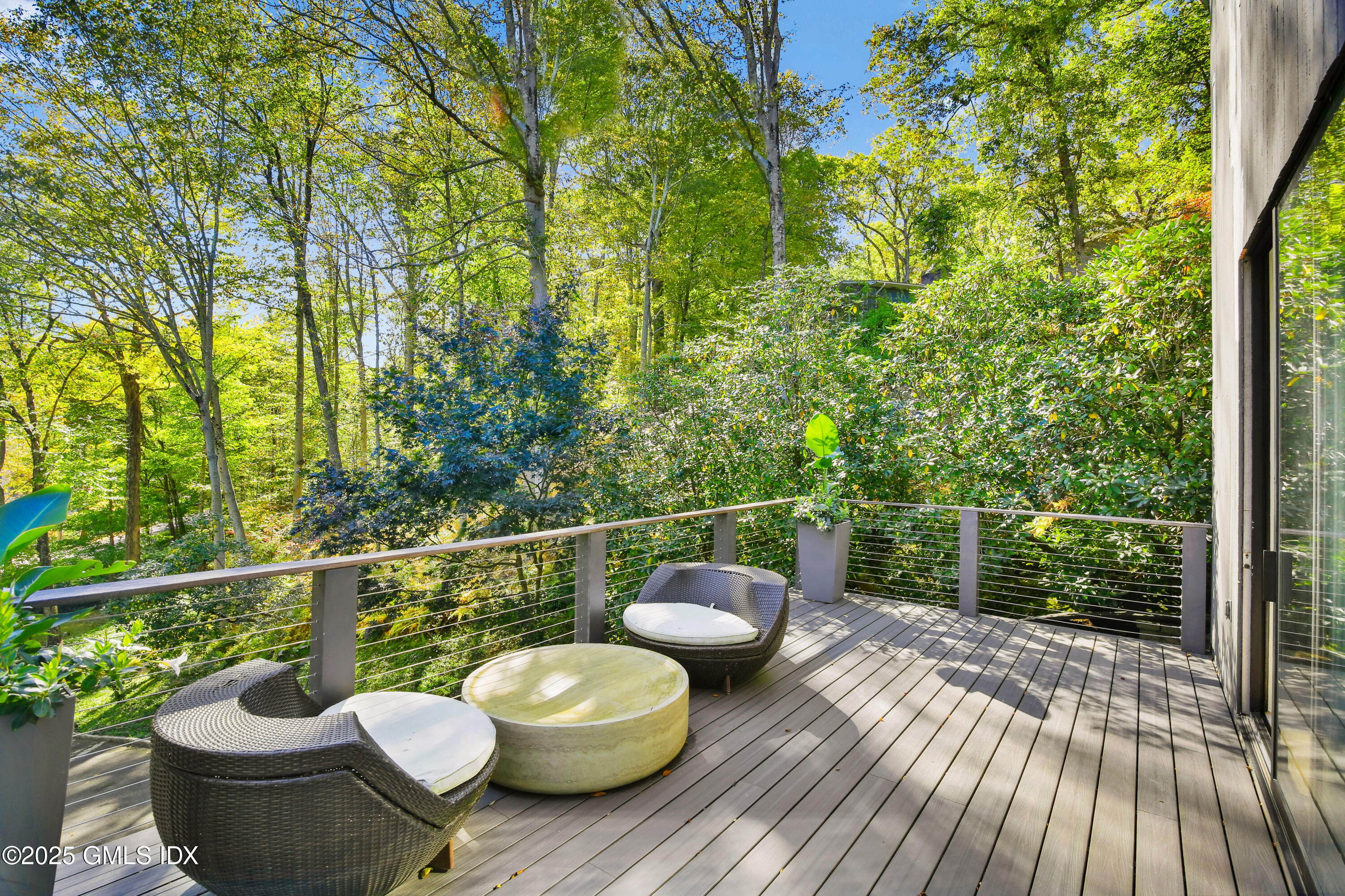210 Red Fox Road Stamford, CT 06903 - Photo 5 of 25 a view of a deck with wooden floor and a potted plant