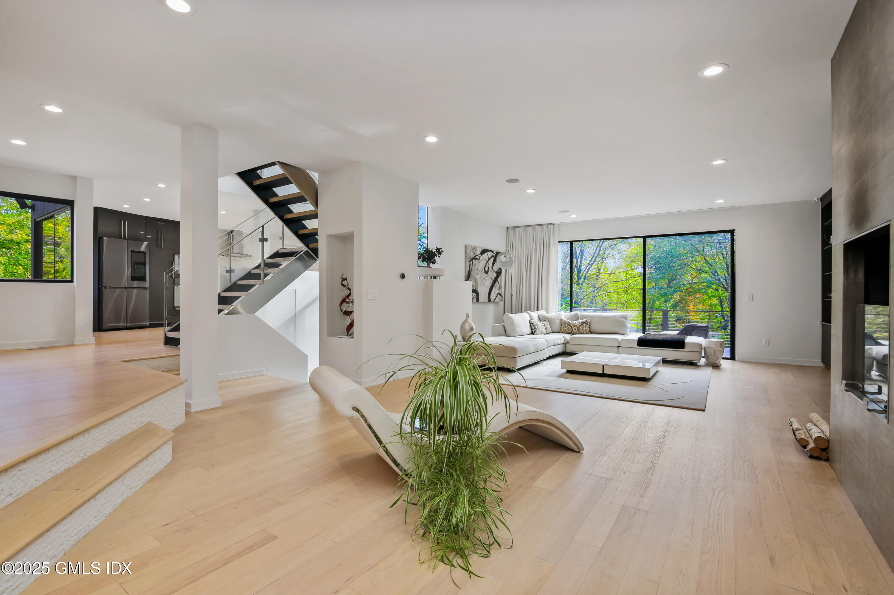 210 Red Fox Road Stamford, CT 06903 - Photo 6 of 25 a living room with furniture and a large window