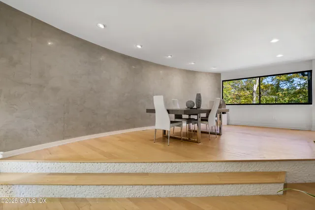 a kitchen with a table and chairs