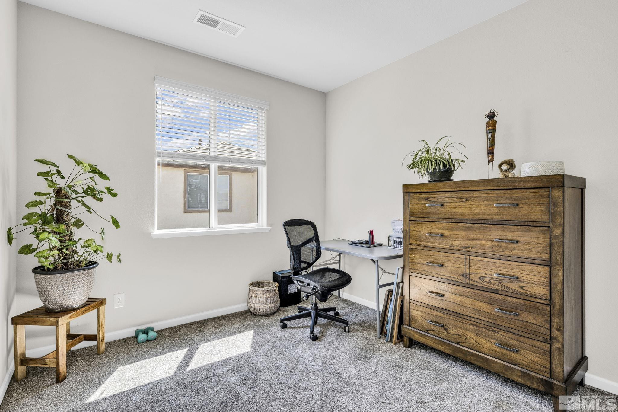 2215 Symphony Way Reno, NV 89521 - Photo 11 of 39 a room with furniture and a window