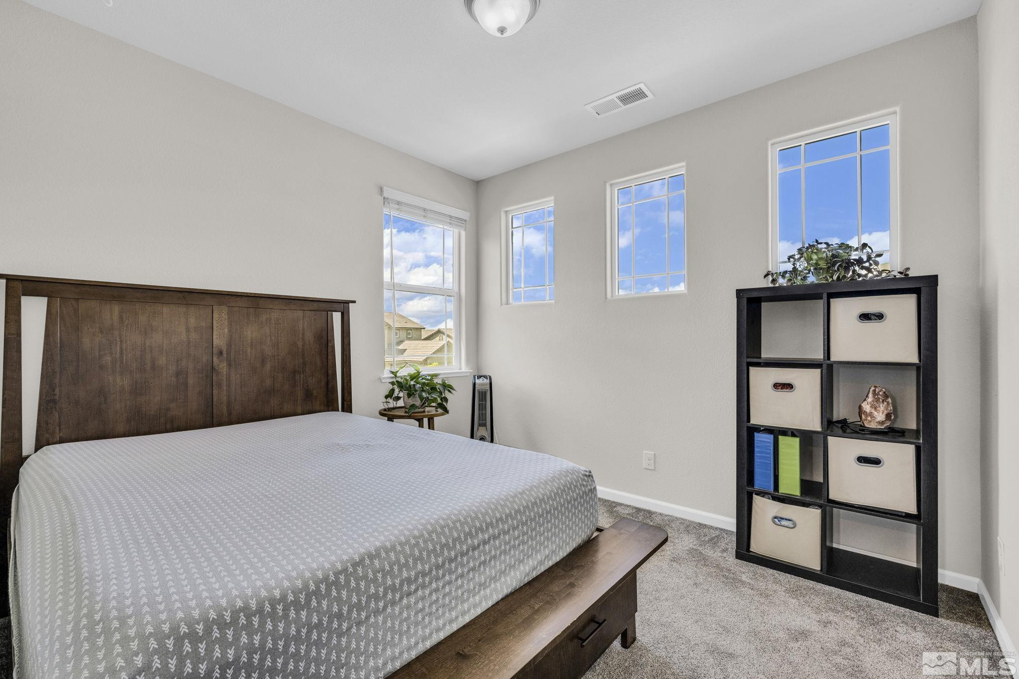 2215 Symphony Way Reno, NV 89521 - Photo 14 of 39 a bedroom with a bed and a window