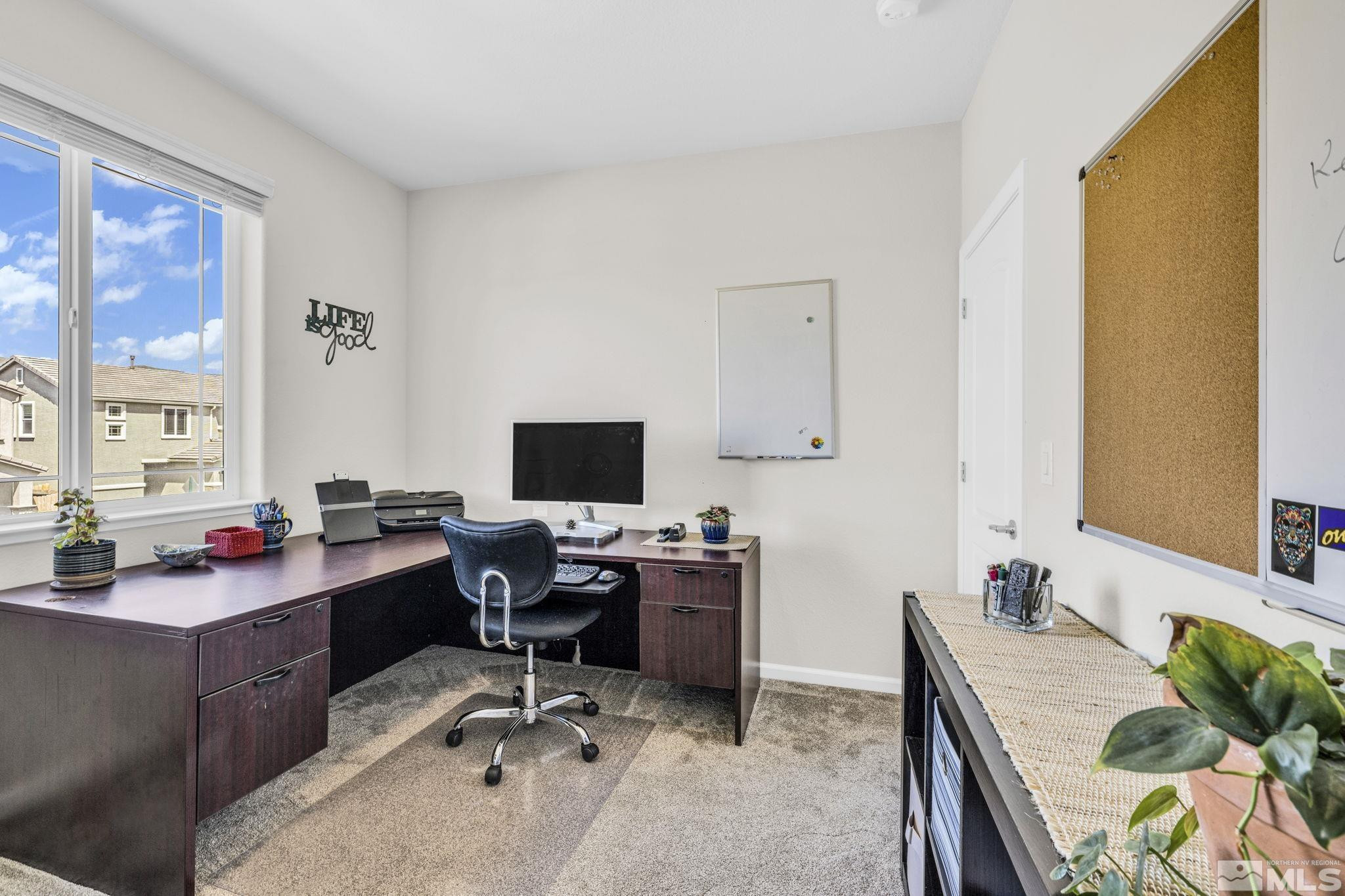 2215 Symphony Way Reno, NV 89521 - Photo 15 of 39 a view of a workspace with furniture and a window