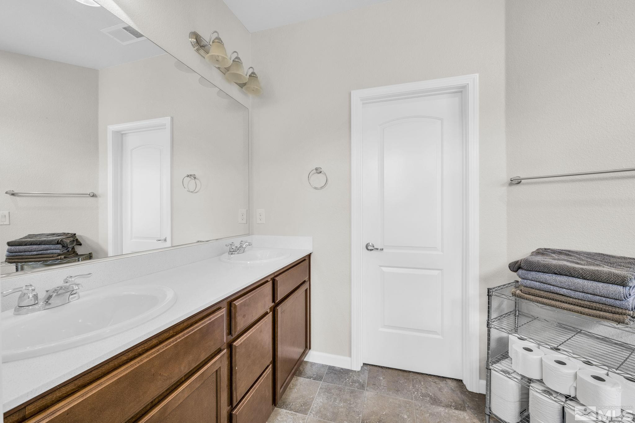 2215 Symphony Way Reno, NV 89521 - Photo 17 of 39 a utility room with cabinets
