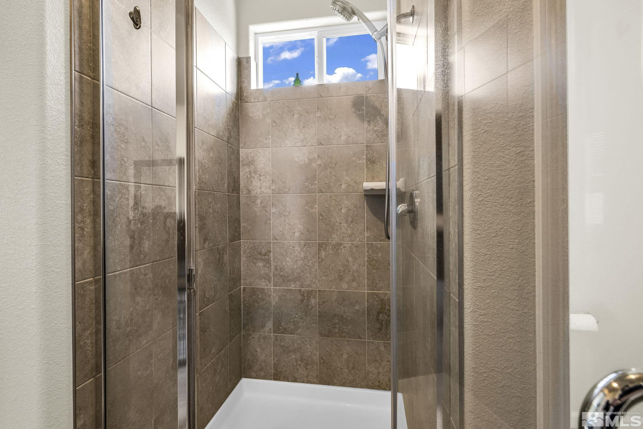 2215 Symphony Way Reno, NV 89521 - Photo 18 of 39 a bathroom with a shower