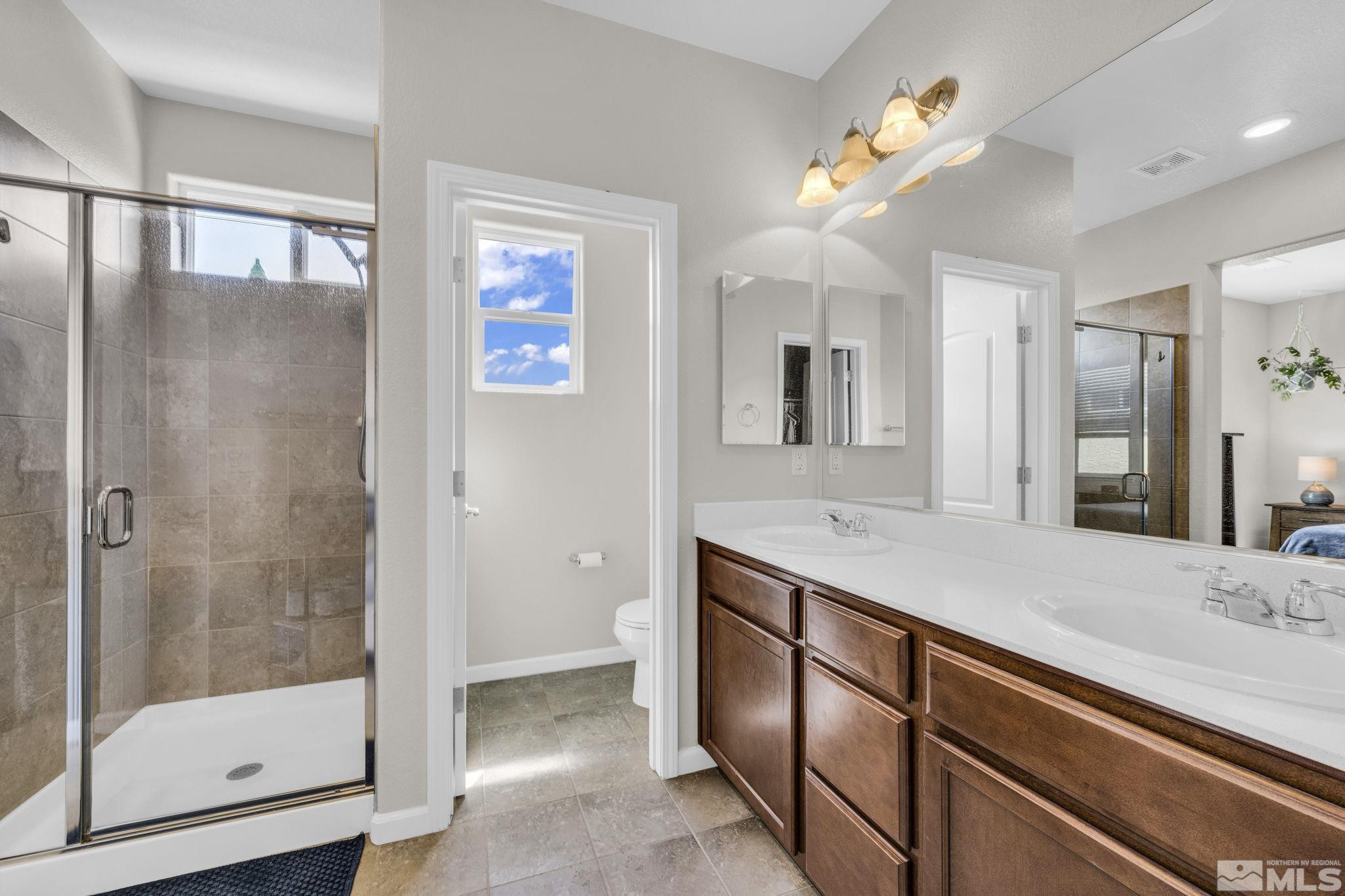 2215 Symphony Way Reno, NV 89521 - Photo 19 of 39 a bathroom with a sink and a mirror