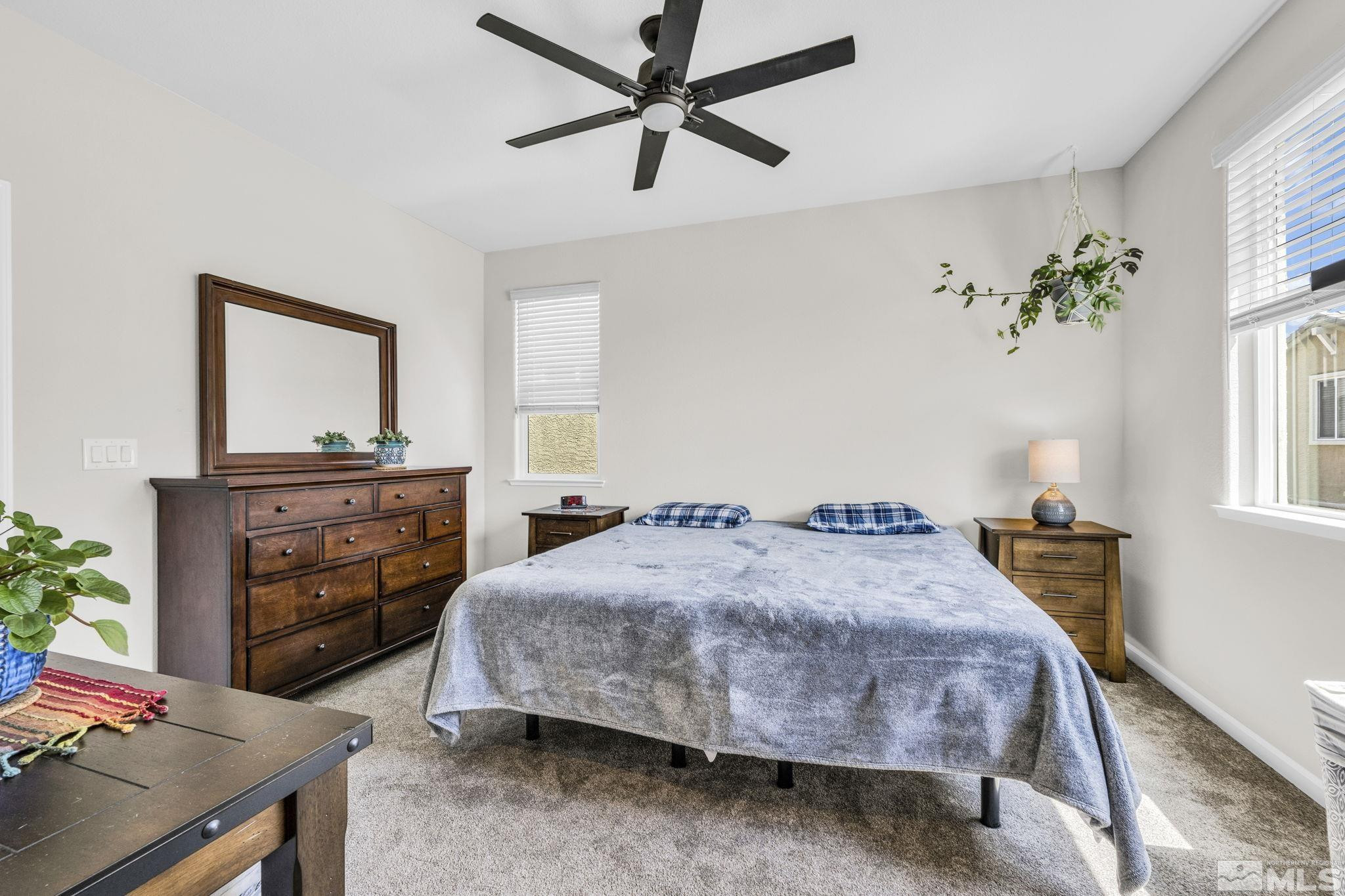 2215 Symphony Way Reno, NV 89521 - Photo 20 of 39 a bedroom with a bed and a dresser