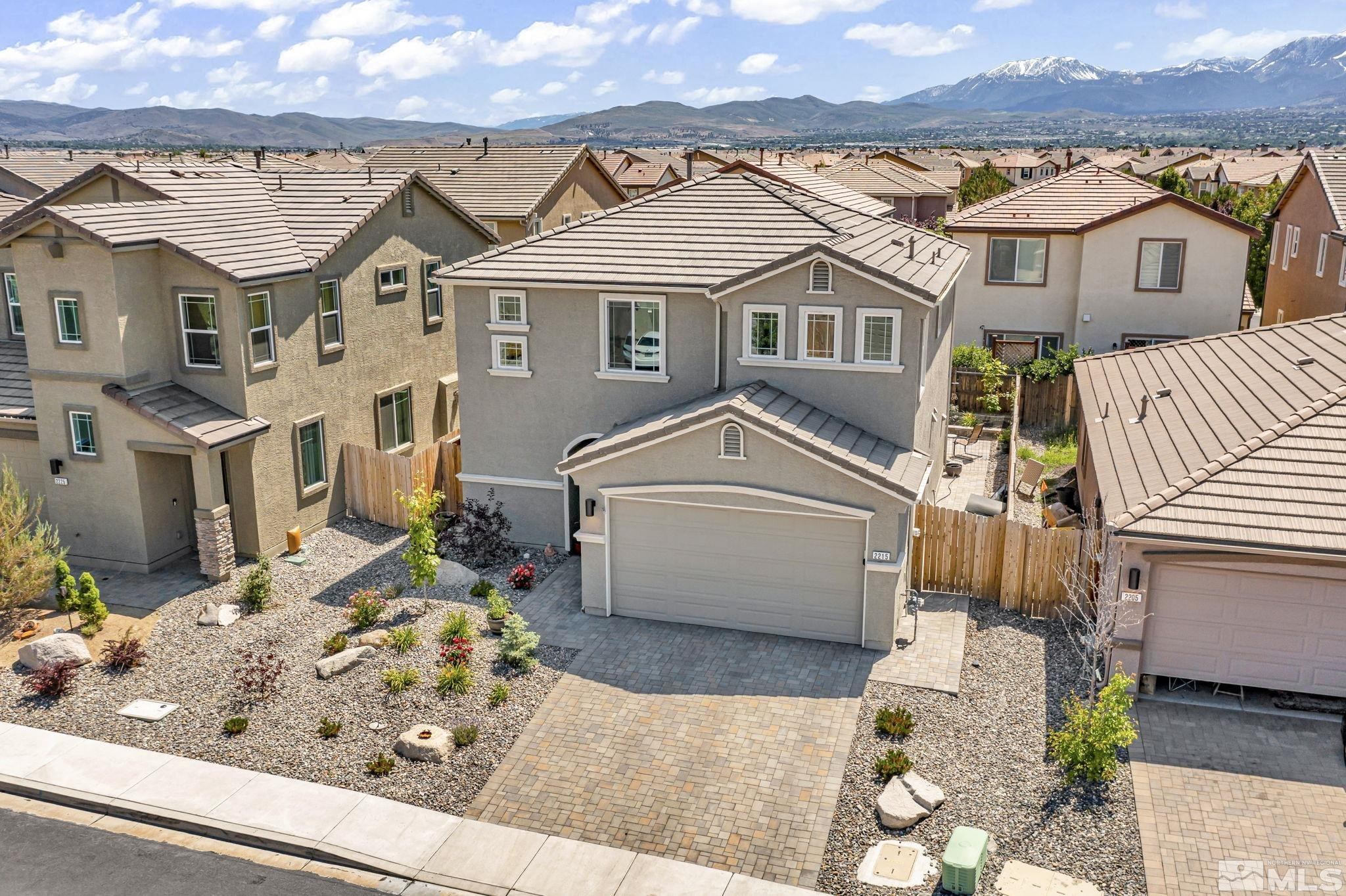 2215 Symphony Way Reno, NV 89521 - Photo 31 of 39 front view of a house with a yard