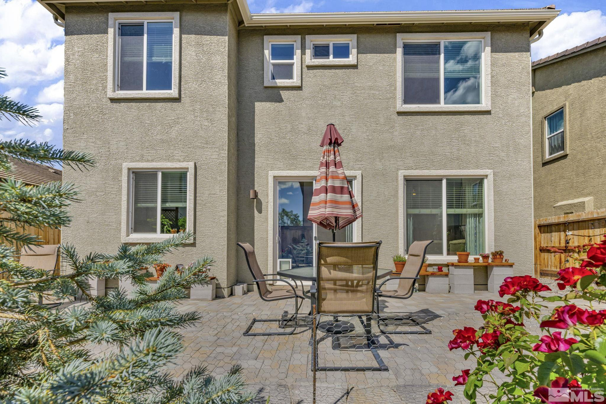 2215 Symphony Way Reno, NV 89521 - Photo 35 of 39 a front view of a house with outdoor seating