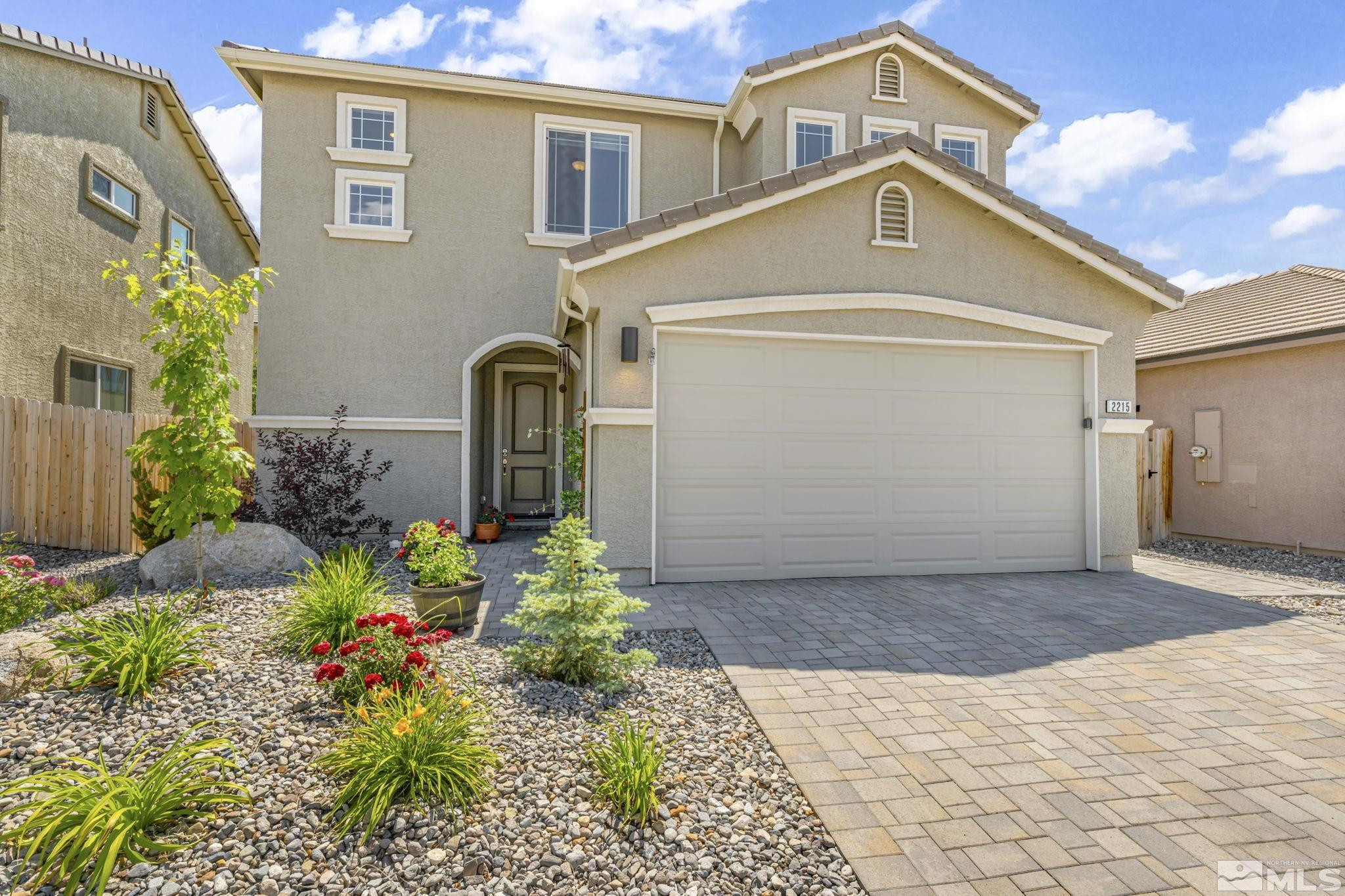 2215 Symphony Way Reno, NV 89521 - Photo 38 of 39 a front view of a house with a yard