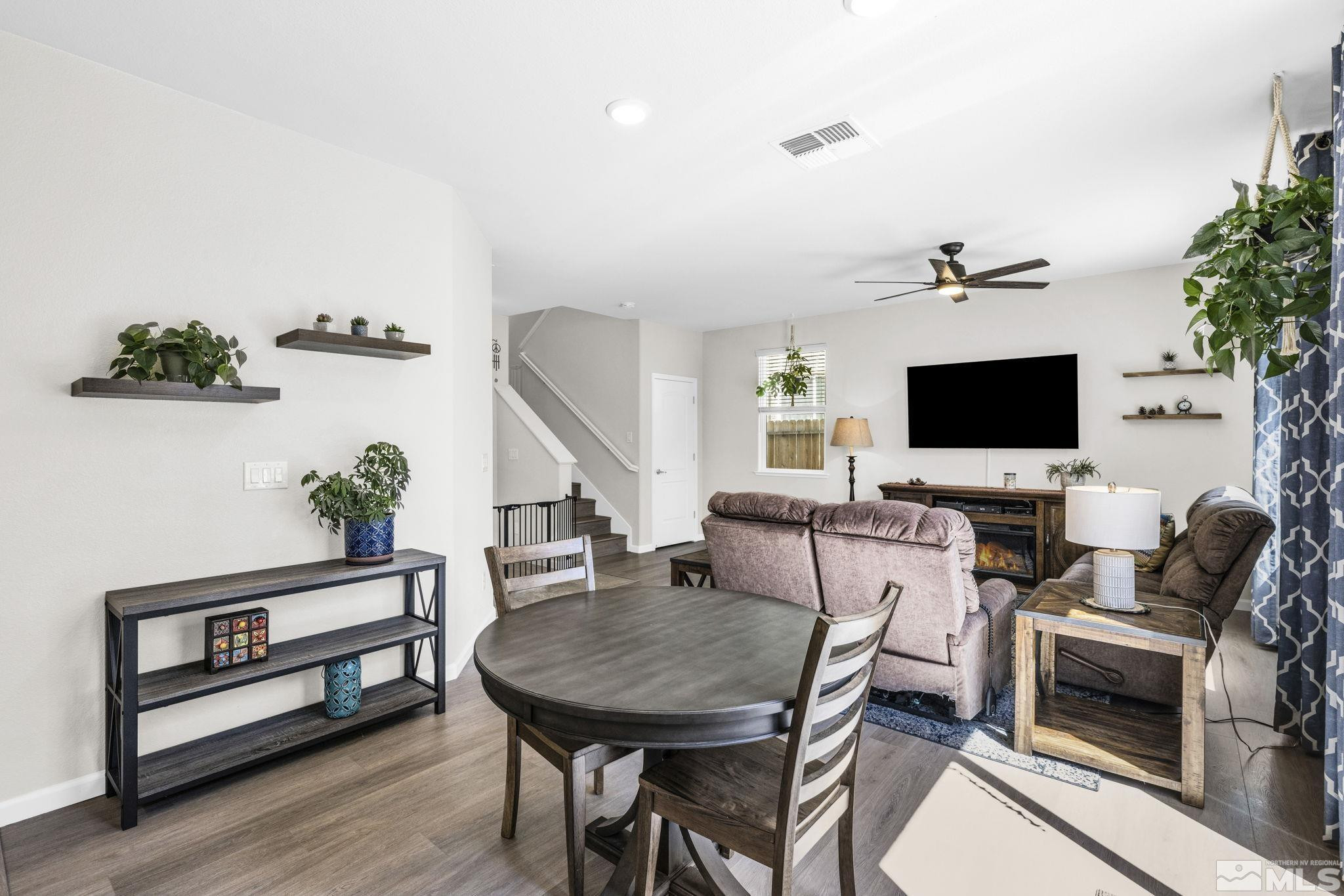2215 Symphony Way Reno, NV 89521 - Photo 5 of 39 a view of a livingroom with furniture and a flat screen tv