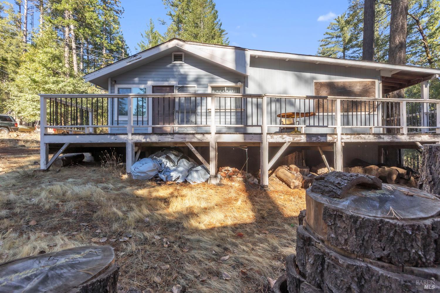 a view of a house with pool and sitting area