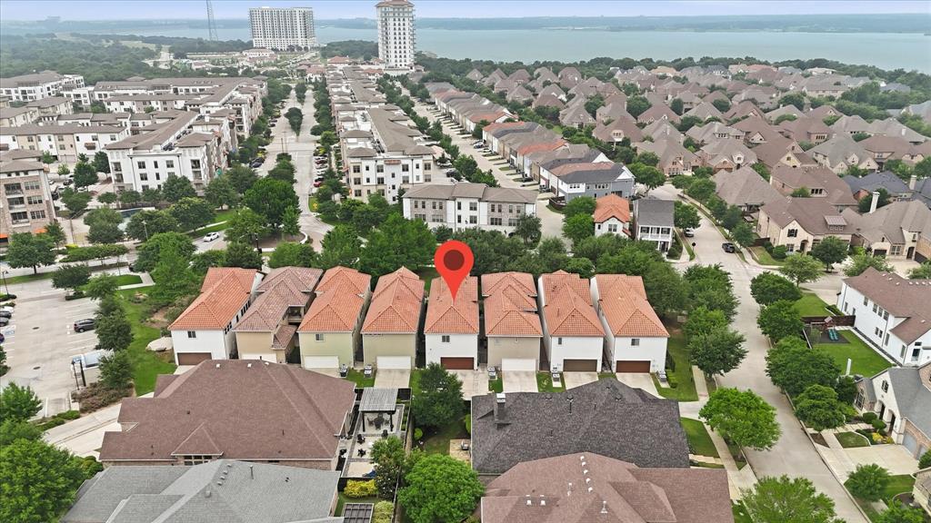 516 Sandy Lane Flower Mound, TX 75022 - Photo 3 of 38 Aerial view of a residential community featuring rows of homes with varying roof styles