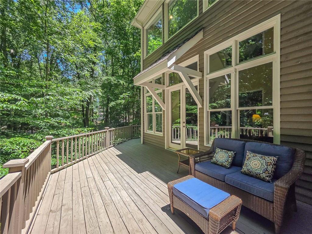 3712 Frederica Road Northwest Berkeley Lake, GA 30096 - Photo 6 of 49 a balcony with wooden floor and outdoor seating