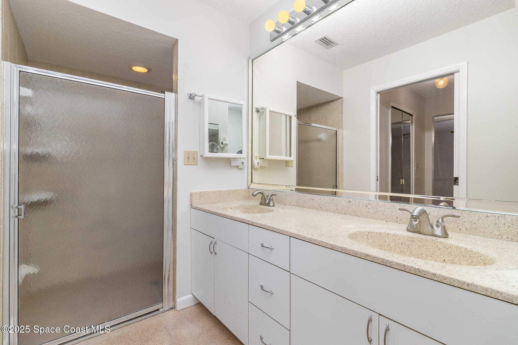 1570 Frontier Drive Melbourne, FL 32940 - Photo 19 of 43 a bathroom with a granite countertop sink mirror and double