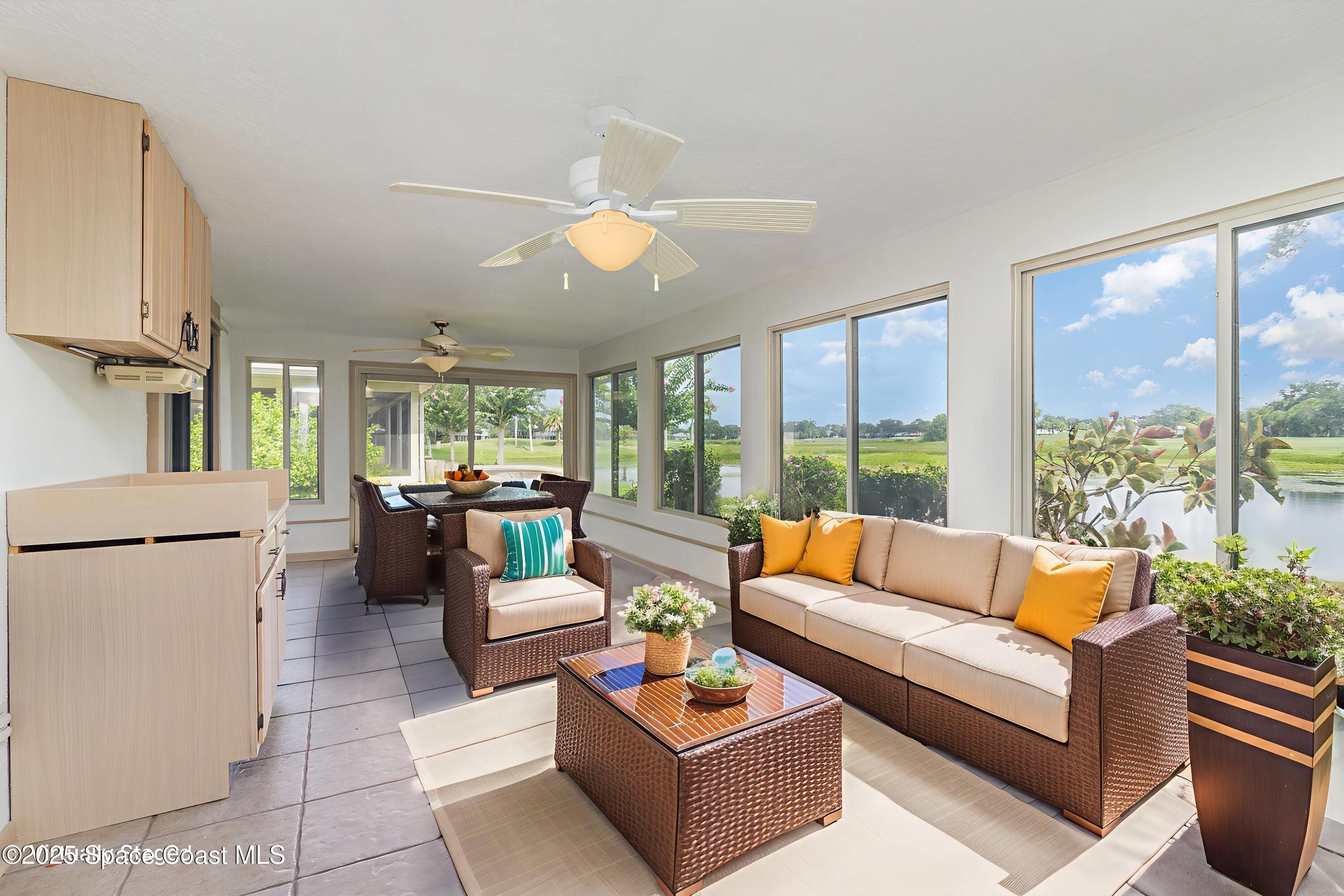 1570 Frontier Drive Melbourne, FL 32940 - Photo 27 of 43 a living room with furniture and a large window