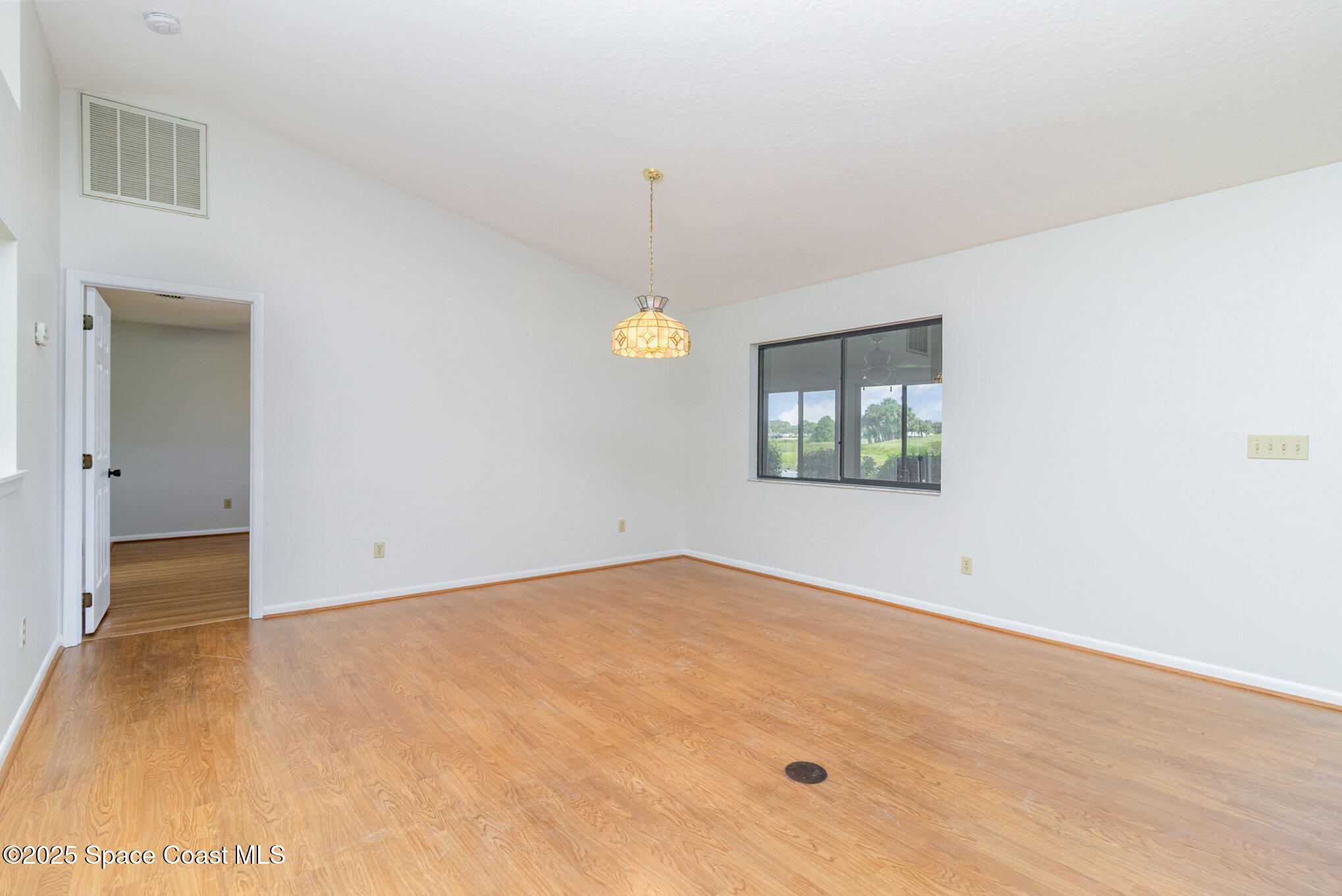 1570 Frontier Drive Melbourne, FL 32940 - Photo 6 of 43 a view of an empty room with a window