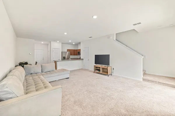 a bedroom with furniture and a flat screen tv
