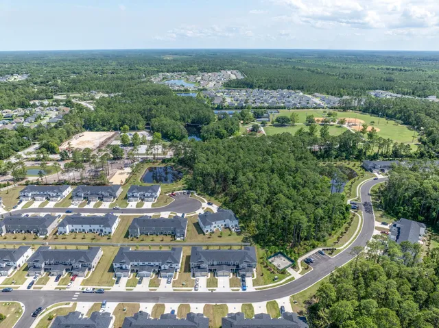 an aerial view of a house with a garden