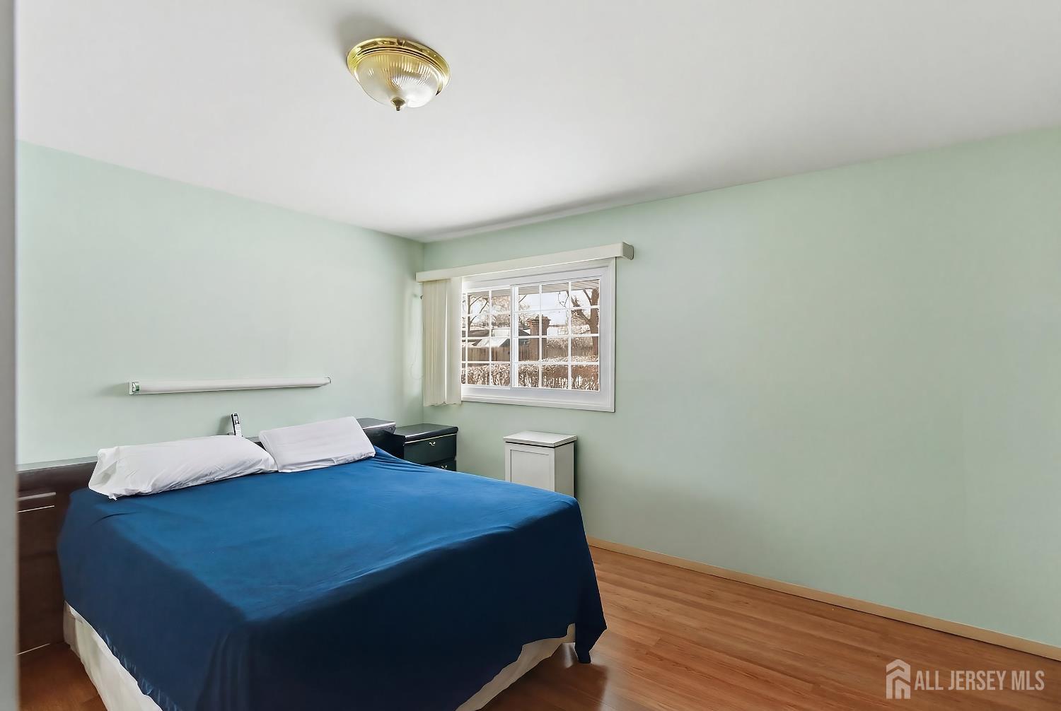 10 Cranston Road Kendall Park, NJ 08824 - Photo 14 of 27 a bedroom with a bed and a window