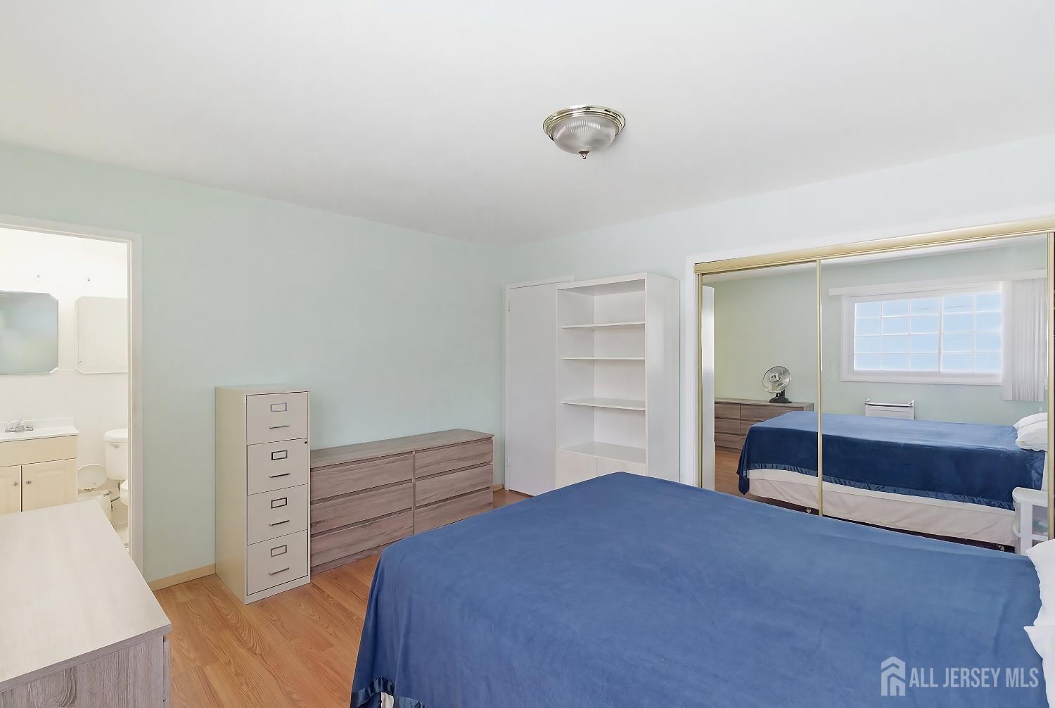 10 Cranston Road Kendall Park, NJ 08824 - Photo 15 of 27 a bedroom with a bed and a dresser